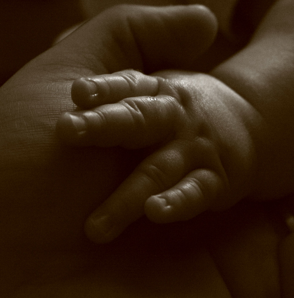 A baby's hand reaching out.