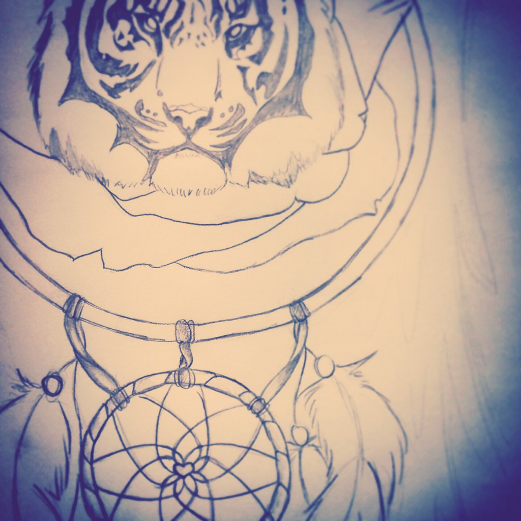 A dreamcatcher with a tiger motif.