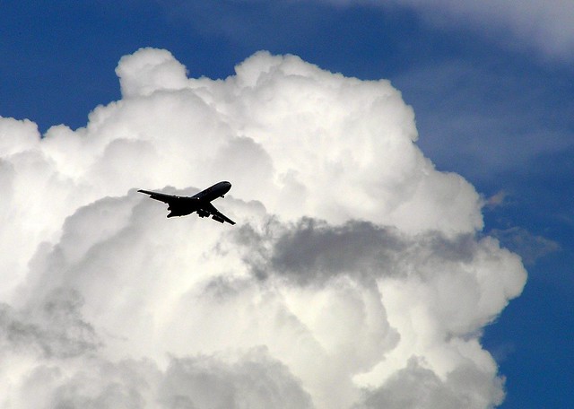 A plane flying through stormy clouds.