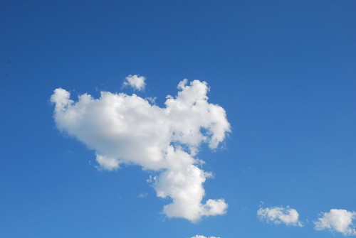 A simple image of a house with a thought bubble or clouds representing dreams.
