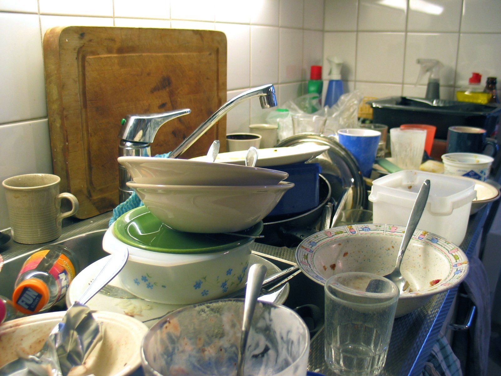 A sink full of dirty dishes.