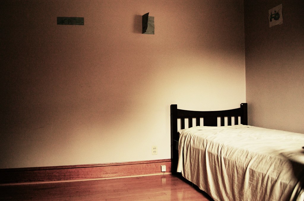 An empty room with a closed door.