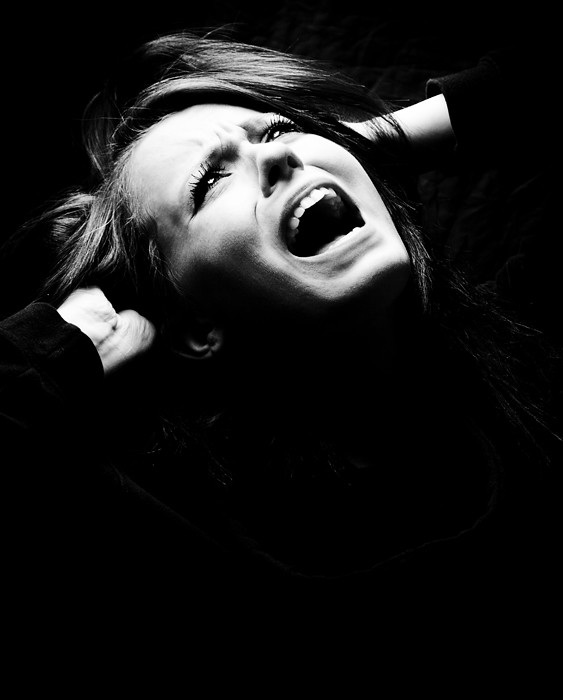 An image of a person screaming in their sleep.