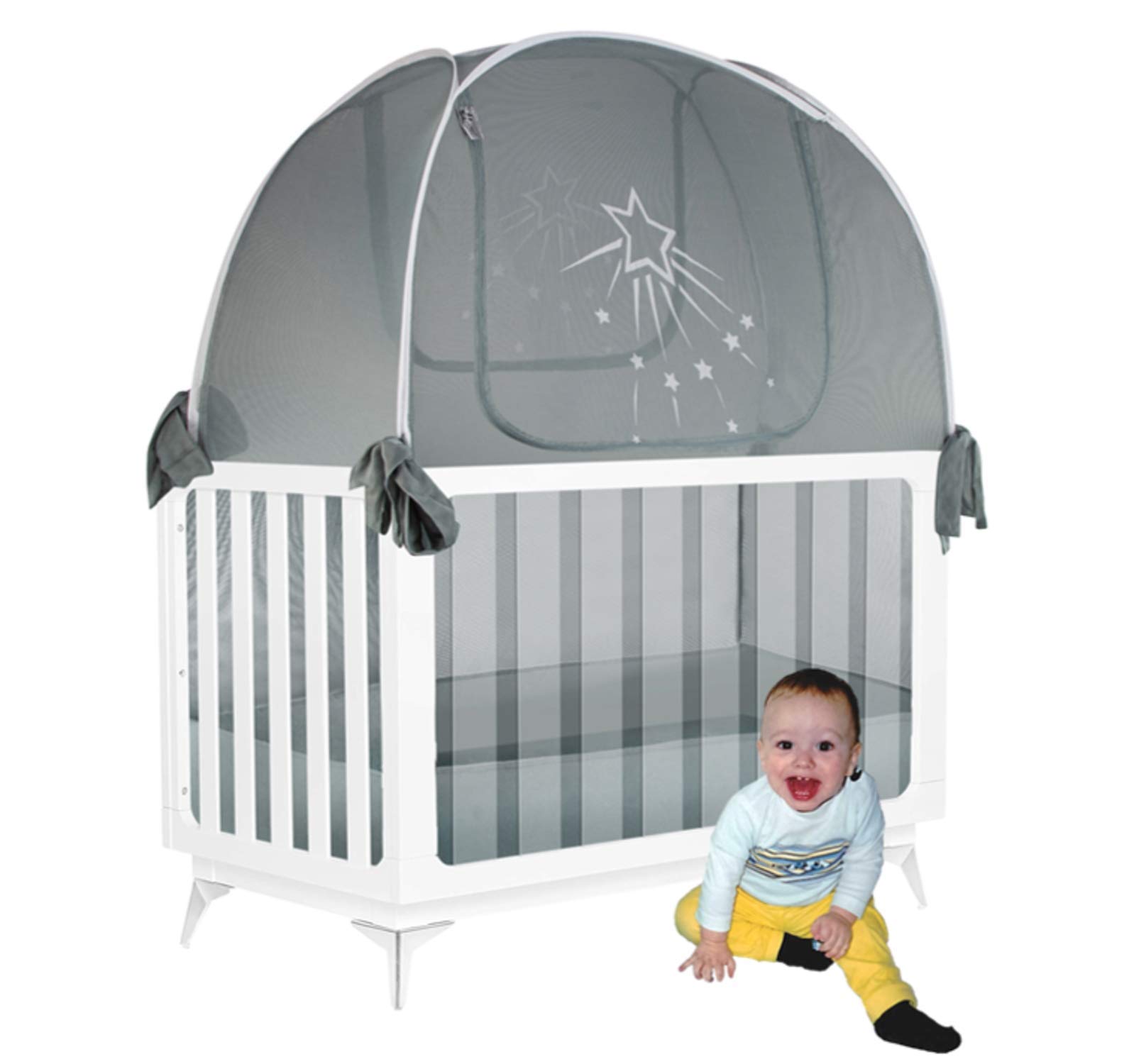 Baby in a crib with a safety net