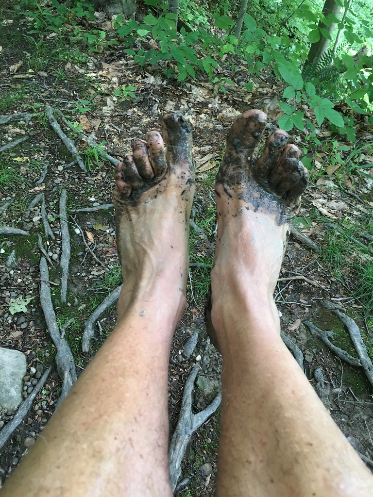 Bare feet on a mountain trail.