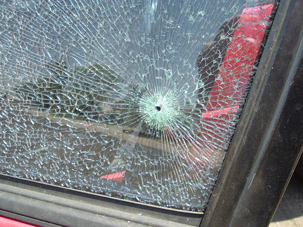 Car window with a shattered glass.