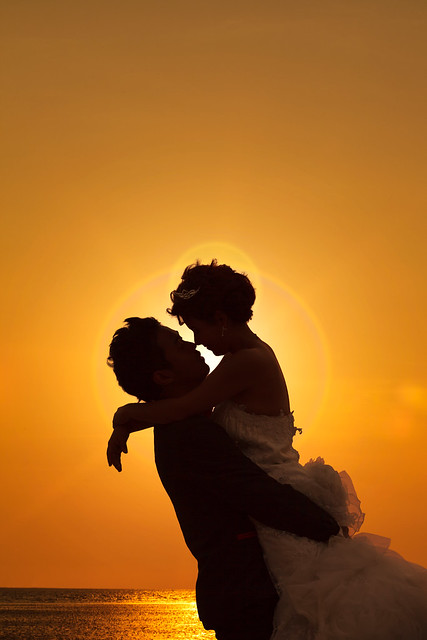 Couple embracing in a sunset.