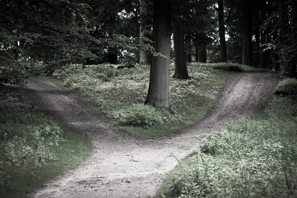 Couple standing at a crossroads