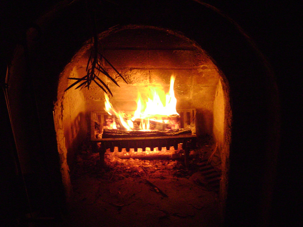 Cozy fireplace with a person sitting and dreaming