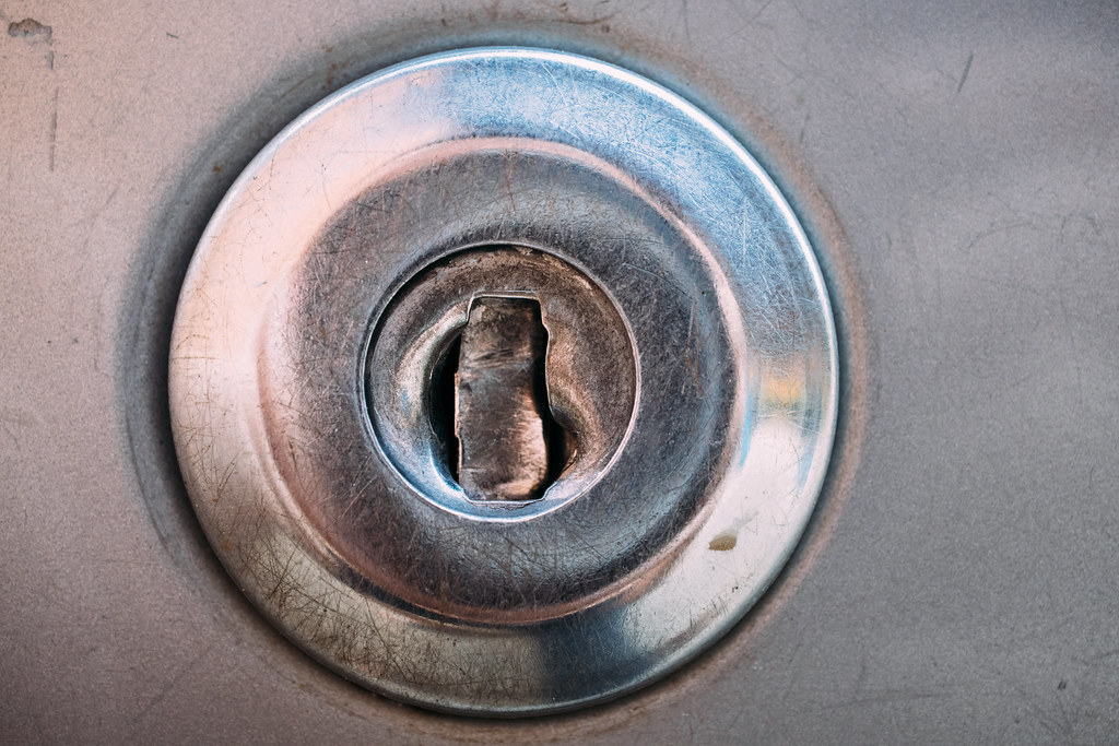 Image of a broken car door lock.
