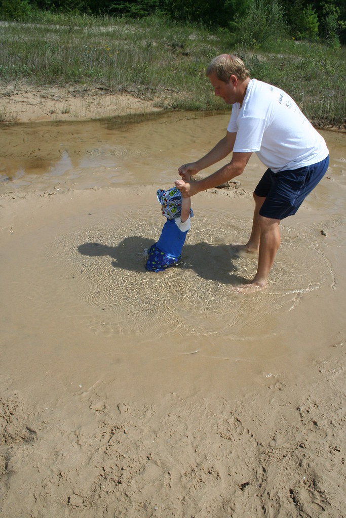 Image of a person sinking in sand