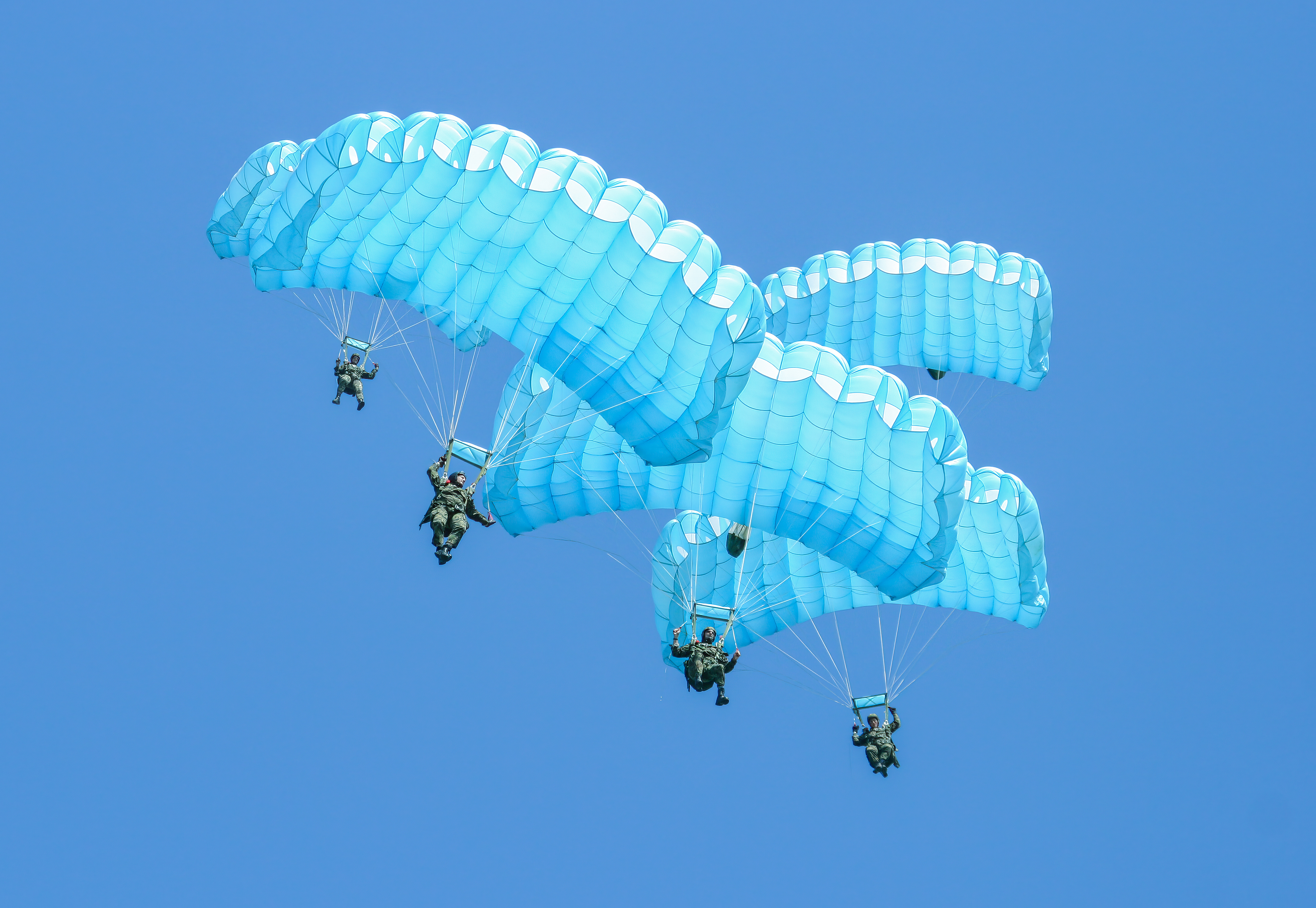 Parachutist jumping out of an airplane