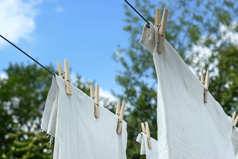 White clothes hanging on a clothesline.